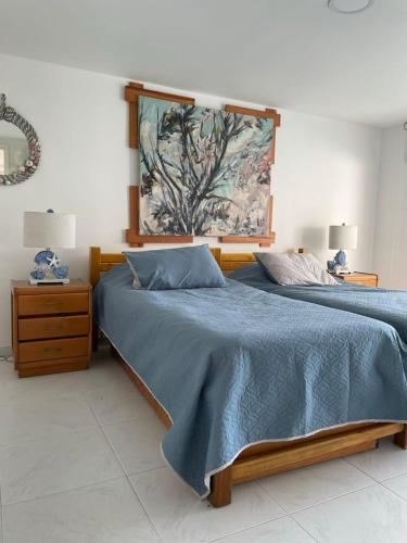 Ένα ή περισσότερα κρεβάτια σε δωμάτιο στο Coral APTS Al Frente de la playa