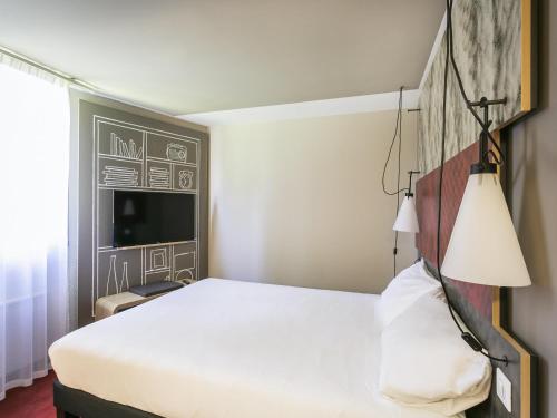 Postel nebo postele na pokoji v ubytování ibis Avignon Sud
