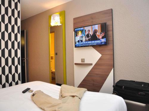 ibis Styles Rouen Nord-Barentinにあるベッド