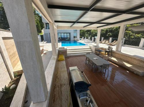 an overhead view of a house with a swimming pool at Villa Sunlight in Gonio