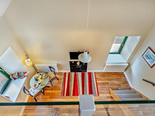 an attic living room with a red and white rug at 1 Bed in Dunning CA333 in Dunning