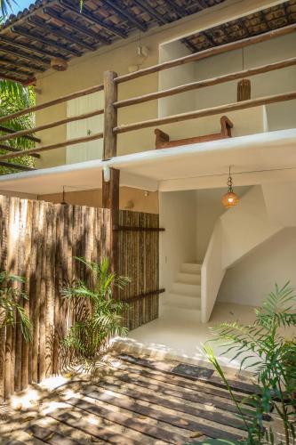 a house with a staircase on the side of it at POUSADA CARMELITHA in Trancoso