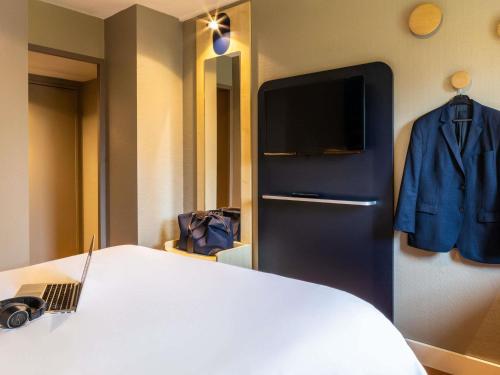 Un ou plusieurs lits dans un hébergement de l'établissement ibis Aulnay Paris Nord Expo