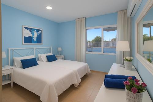 Ένα ή περισσότερα κρεβάτια σε δωμάτιο στο GOLDEN BEACH MOGAN