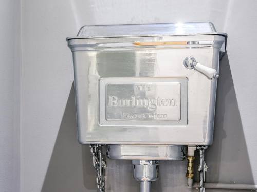 a silver tank with aburningiction sign on it at 2 bed property in Exeter 79431 in Sandford
