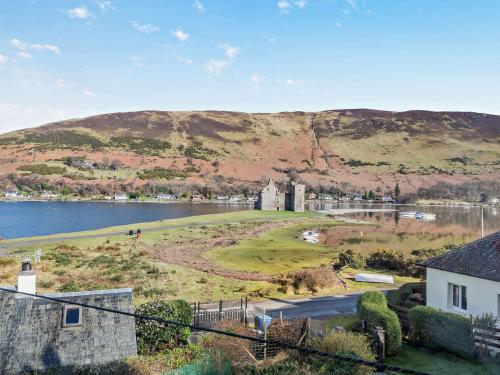 an island in the middle of a body of water at 2 Bed in Lochranza 77882 in Lochranza