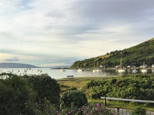 a view of a body of water with boats in it at 2 Bed in Lochranza 77882 in Lochranza