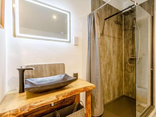 a bathroom with a sink and a shower at 3 Bed in Bideford 79552 in Bideford