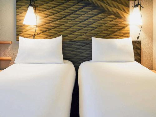Letto o letti in una camera di ibis Toulon La Seyne sur Mer