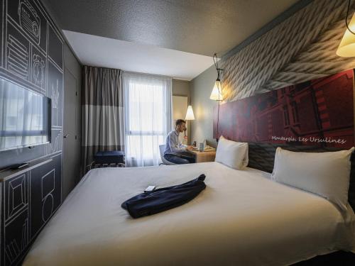 Ein Bett oder Betten in einem Zimmer der Unterkunft ibis Montargis