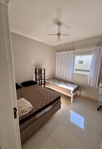 Katil atau katil-katil dalam bilik di Ninho verde ll casa com piscina