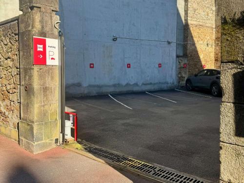 a parking lot with a car parked in it at ibis Limoges Centre in Limoges