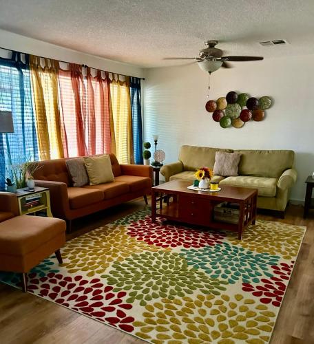 a living room with two couches and a coffee table at Entire Vacation home blocks to the Strip, ARTS Dist, & Main Street Sleeps up to 8 in Las Vegas