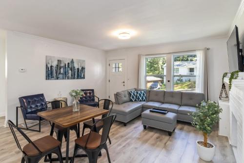 a living room with a couch and a table at New Home in MidTown- Sleeps 11 For Rent in Atlanta in Atlanta