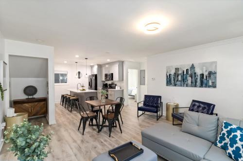 a living room with a couch and a table at New Home in MidTown- Sleeps 11 For Rent in Atlanta in Atlanta