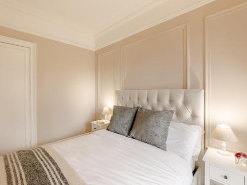 a bedroom with a white bed with two pillows at 9 Bed in Keswick SZ238 in Keswick