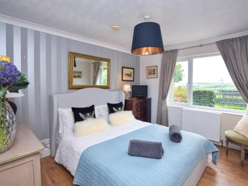 Ένα ή περισσότερα κρεβάτια σε δωμάτιο στο 6 Bed in Buckland Brewer SWOLD