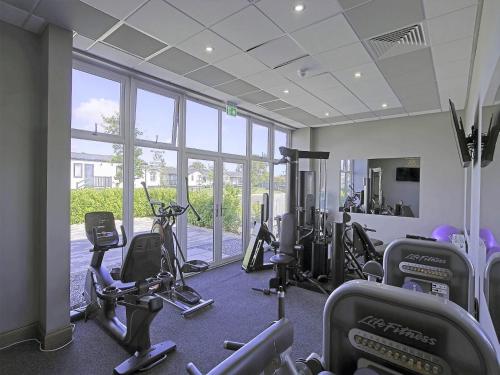 a gym with treadmills and cardio equipment in a building at 2 Bed in St Andrews 90764 in St. Andrews