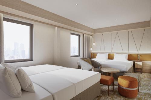 Giường trong phòng chung tại Mitsui Garden Hotel Sapporo