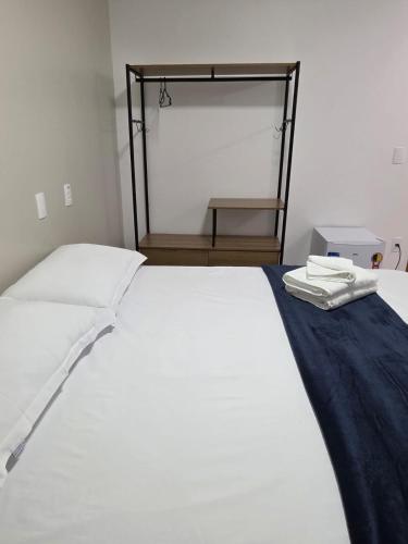 Ένα ή περισσότερα κρεβάτια σε δωμάτιο στο Ello Hotel Cristalina