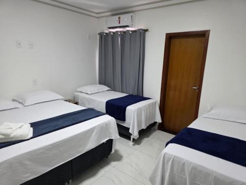 Ένα ή περισσότερα κρεβάτια σε δωμάτιο στο Ello Hotel Cristalina