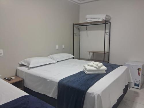 Ένα ή περισσότερα κρεβάτια σε δωμάτιο στο Ello Hotel Cristalina