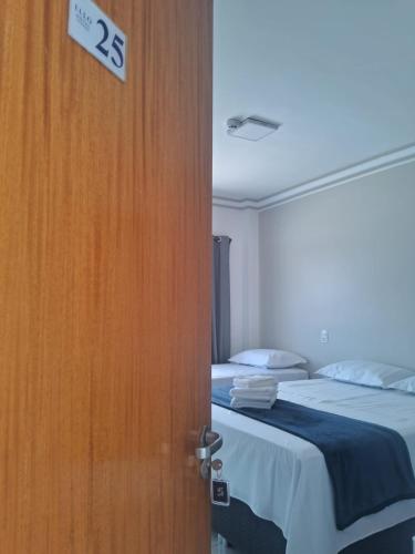 Ένα ή περισσότερα κρεβάτια σε δωμάτιο στο Ello Hotel Cristalina