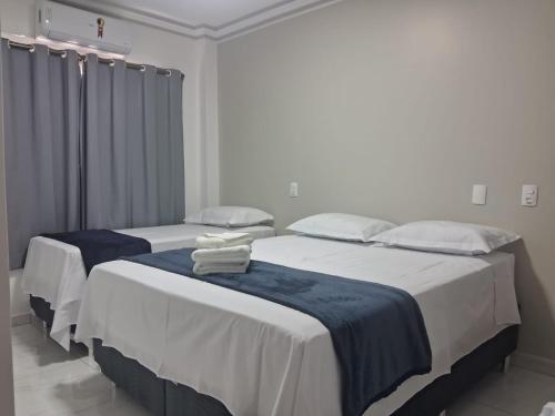 Ένα ή περισσότερα κρεβάτια σε δωμάτιο στο Ello Hotel Cristalina