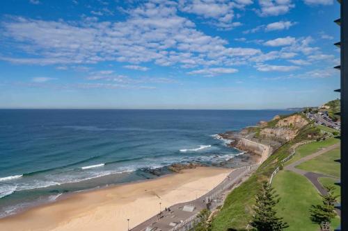 an aerial view of a beach and the ocean at 806 - Beachfront Beauty - Prices Slashed Until Dec 2025 in Newcastle