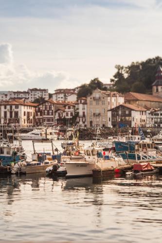 a group of boats are docked in a harbor at Hôtel La Réserve in Saint-Jean-de-Luz