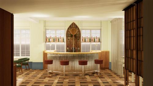 a bar with stools in a room with windows at The Derby London City, Curio Collection By Hilton in London