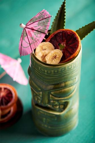 a jar filled with fruit and a potted plant at Sunseeker Resort Florida Gulf Coast, Curio Collection Hilton in Port Charlotte
