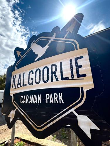 a sign for a calgary caragon park at Kalgoorlie Caravan Park in Kalgoorlie