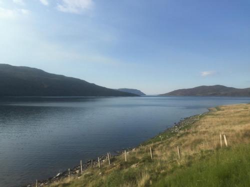 a large body of water with mountains in the background at 3 Bed in Broadford 81181 in Luib