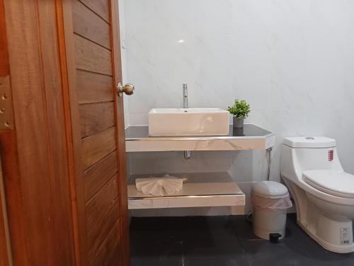 a bathroom with a sink and a toilet at Jungle View Resort in Ko Chang