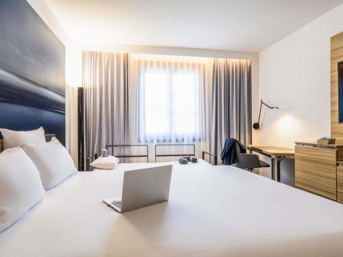 Una cama o camas en una habitación de Hotel Novotel Brussels Off Grand Place