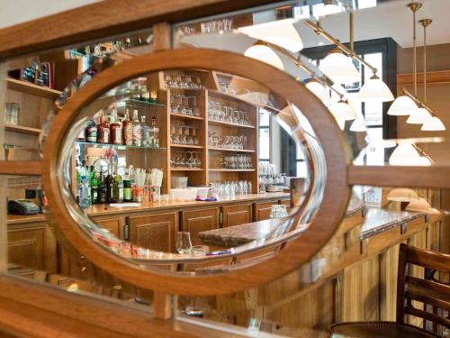 a reflection of a bar in a mirror at ibis Hotel Brussels off Grand'Place in Brussels