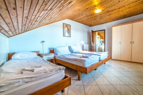 Postel nebo postele na pokoji v ubytování Villa Paolija