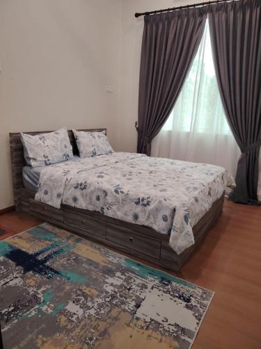 a bedroom with a bed and a large window at MA Homestay Kuala Nerus, Kuala Terengganu in Kuala Terengganu