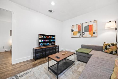 a living room with a couch and a table at 4BR Modern Getaway by Lackland & SeaWorld in San Antonio