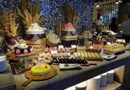 a buffet of desserts and pastries in a store at Adam Hotel Sa Pa in Sa Pa