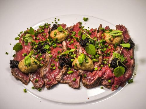 a plate of food on a white plate at Novotel Orléans Saint Jean de Braye in Saint-Jean-de-Braye