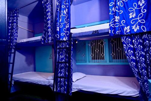 Postel nebo postele na pokoji v ubytování Banaras Rest House