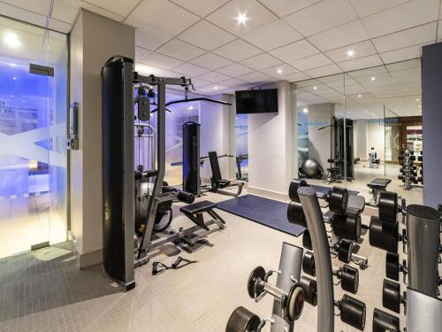 a gym with cardio equipment in a building at Novotel Southampton in Southampton