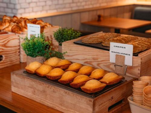 a display of bread and pastries on a table at ibis Marseille Provence Aéroport in Marignane