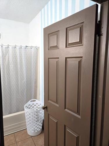 a door in a bathroom with a shower at Ana Maria del Azul in Minneapolis