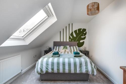 a bedroom with a bed in a attic at No 5 Hedgehog Den in Sparham