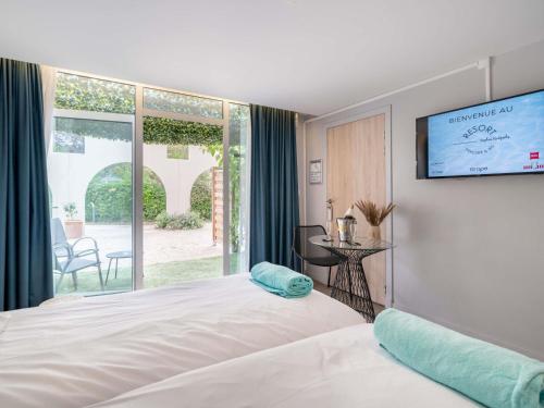 Postel nebo postele na pokoji v ubytování Mercure Antibes Sophia Antipolis