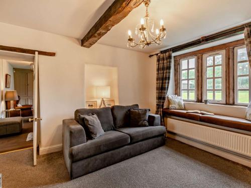 a living room with a couch and a window at 4 Bed in Clitheroe 94409 in Newton