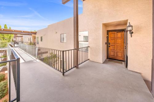 a walkway to a building with a wooden door at Sedona Escape- Pool, Spa, Hike, Dine, Relax in Sedona
